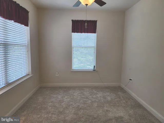 an empty room with a wooden door