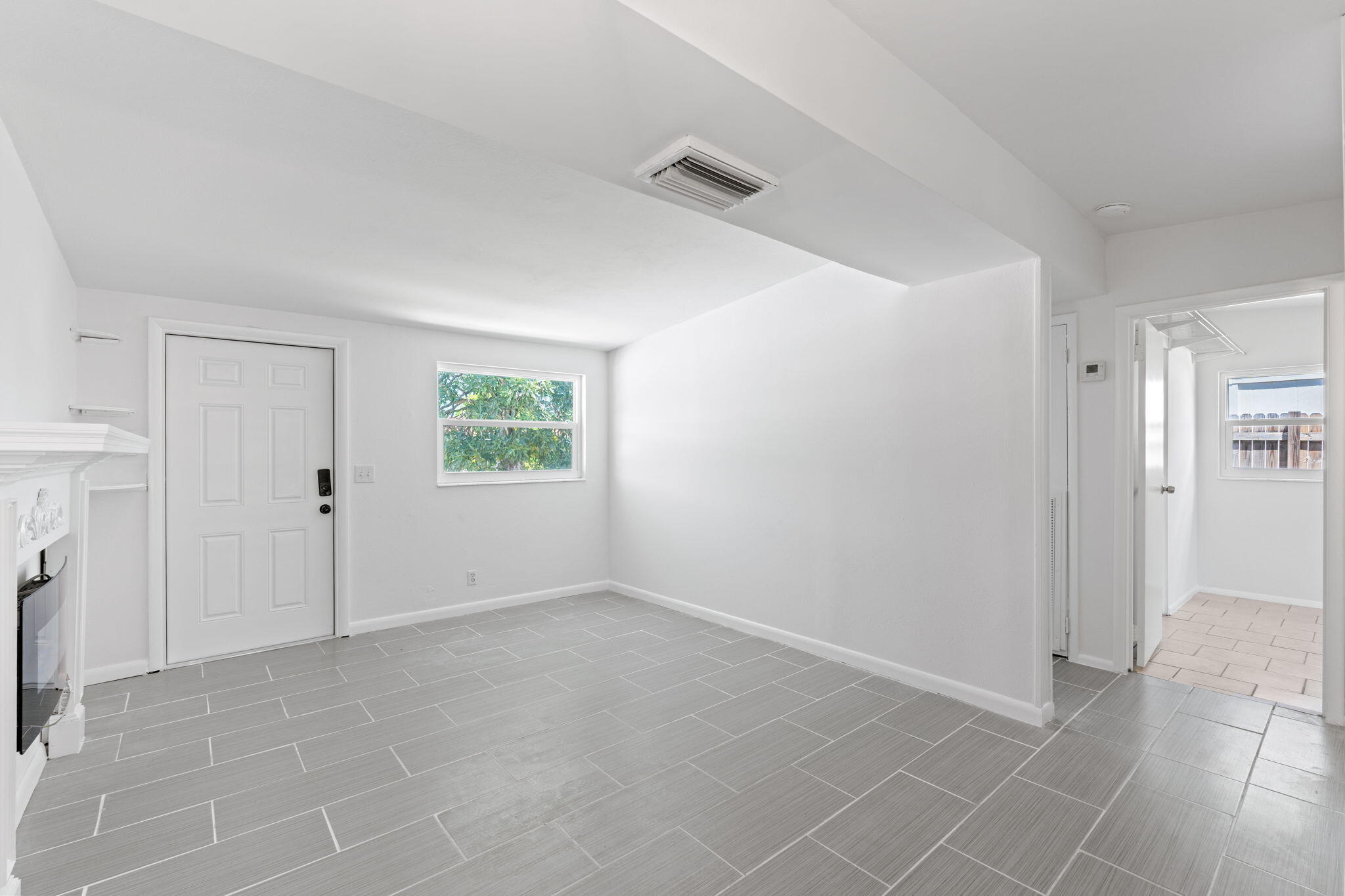 3852 Catalina Road Palm Beach Gardens, FL 33410 - Photo 11 of 48 an empty room with windows and closet