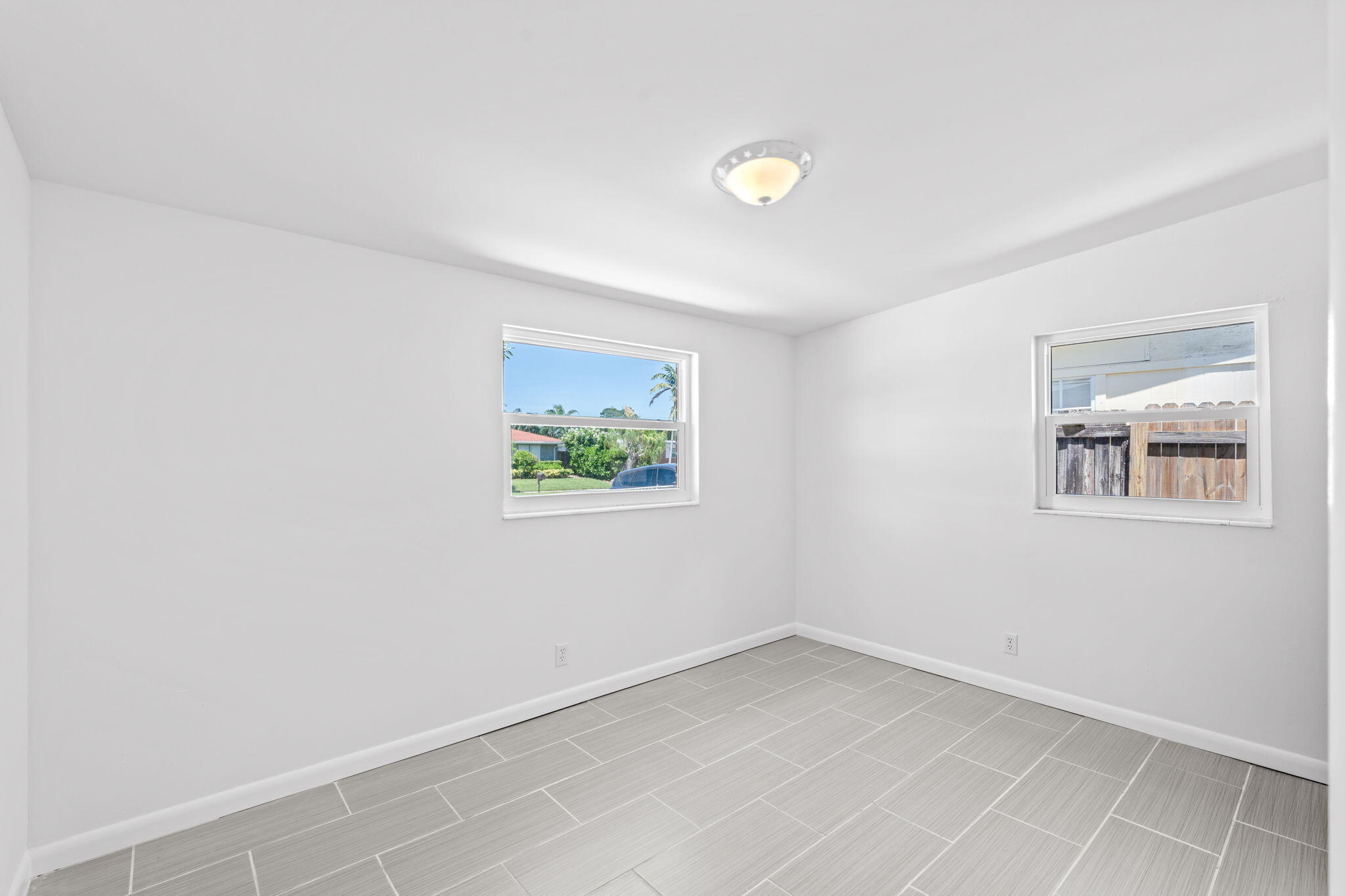 3852 Catalina Road Palm Beach Gardens, FL 33410 - Photo 14 of 48 a view of an empty room with a window