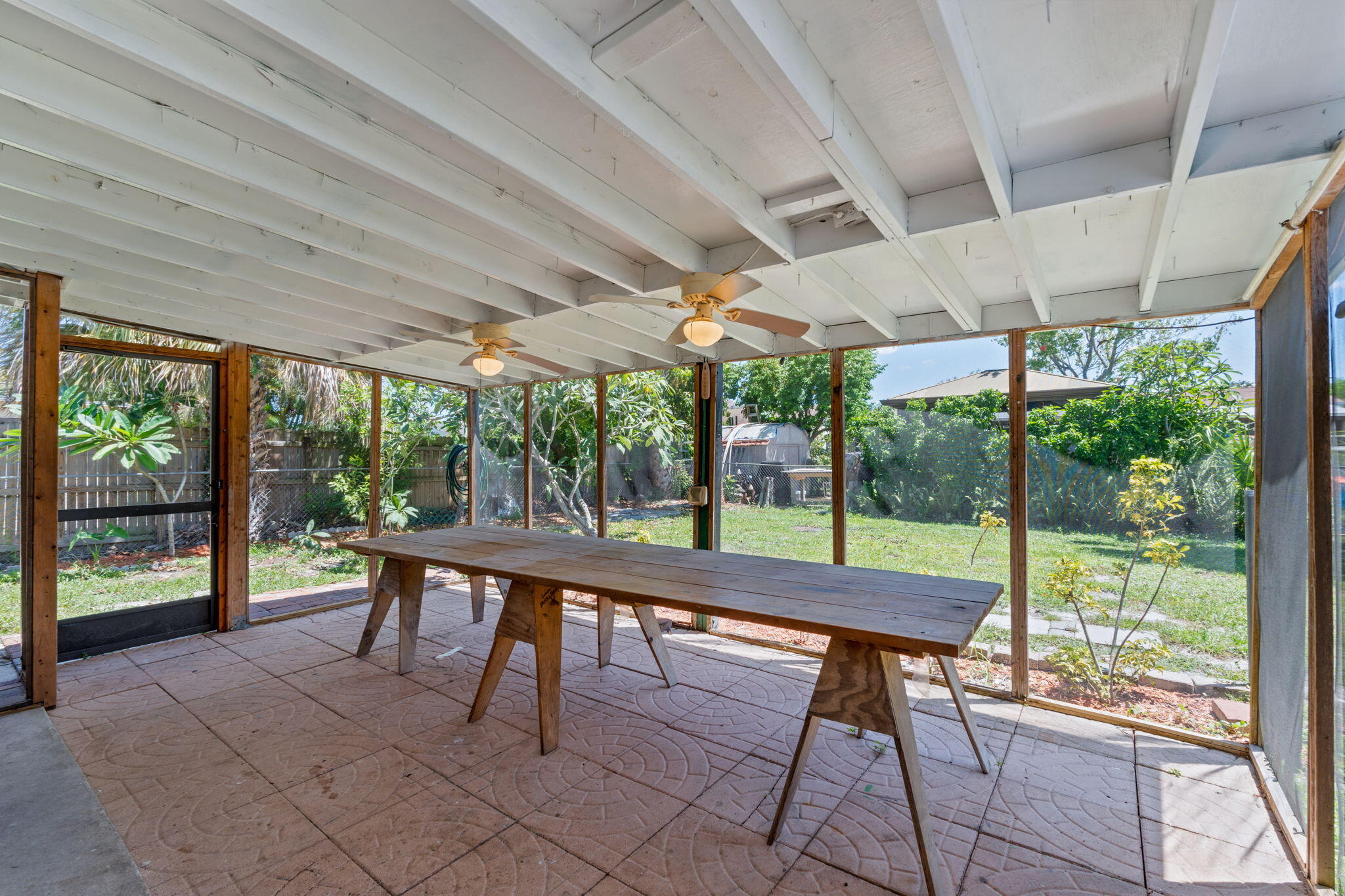 3852 Catalina Road Palm Beach Gardens, FL 33410 - Photo 27 of 48 a outdoor space with a sitting space