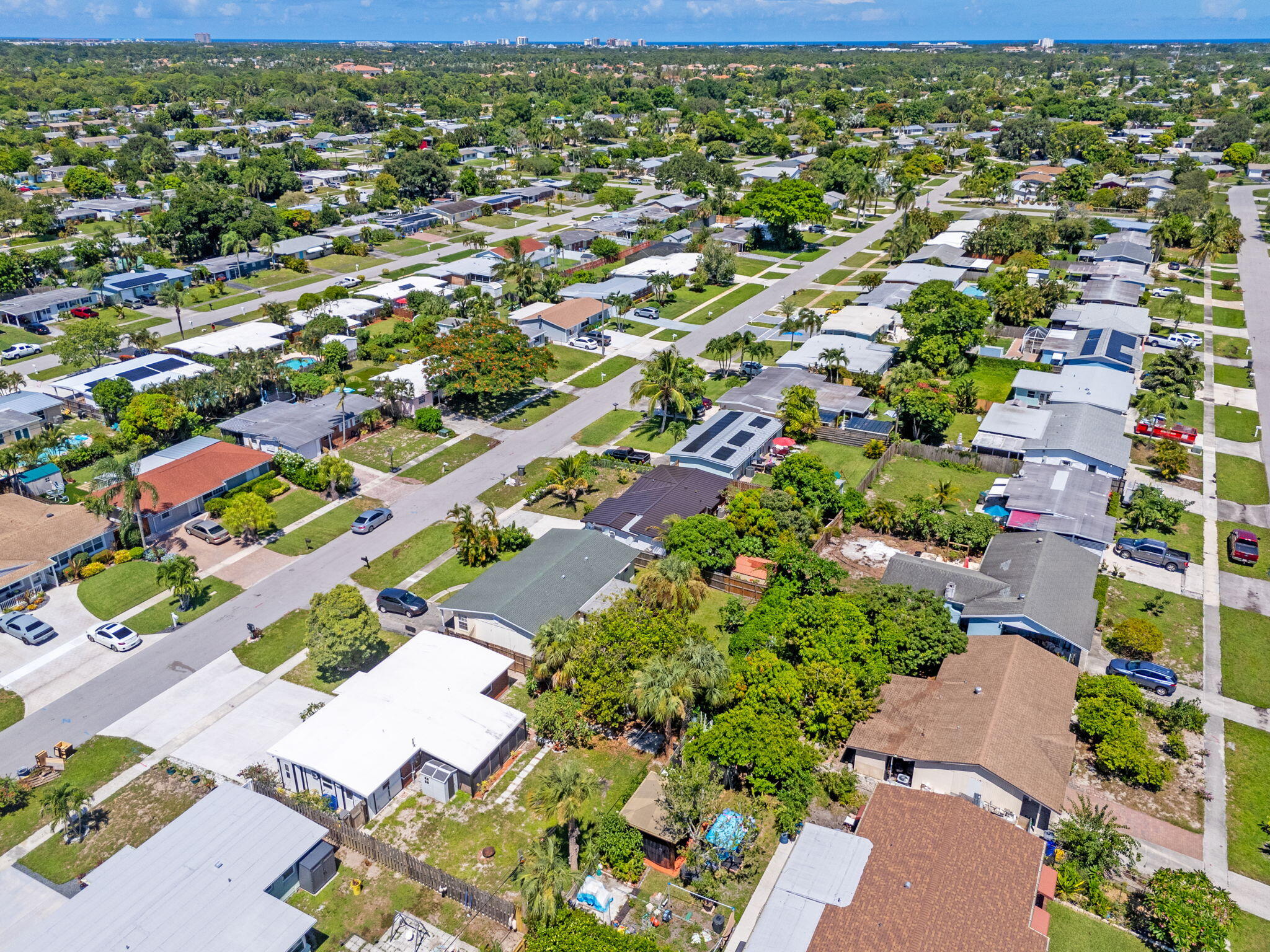3852 Catalina Road Palm Beach Gardens, FL 33410 - Photo 40 of 48 an aerial view of residential houses with outdoor space