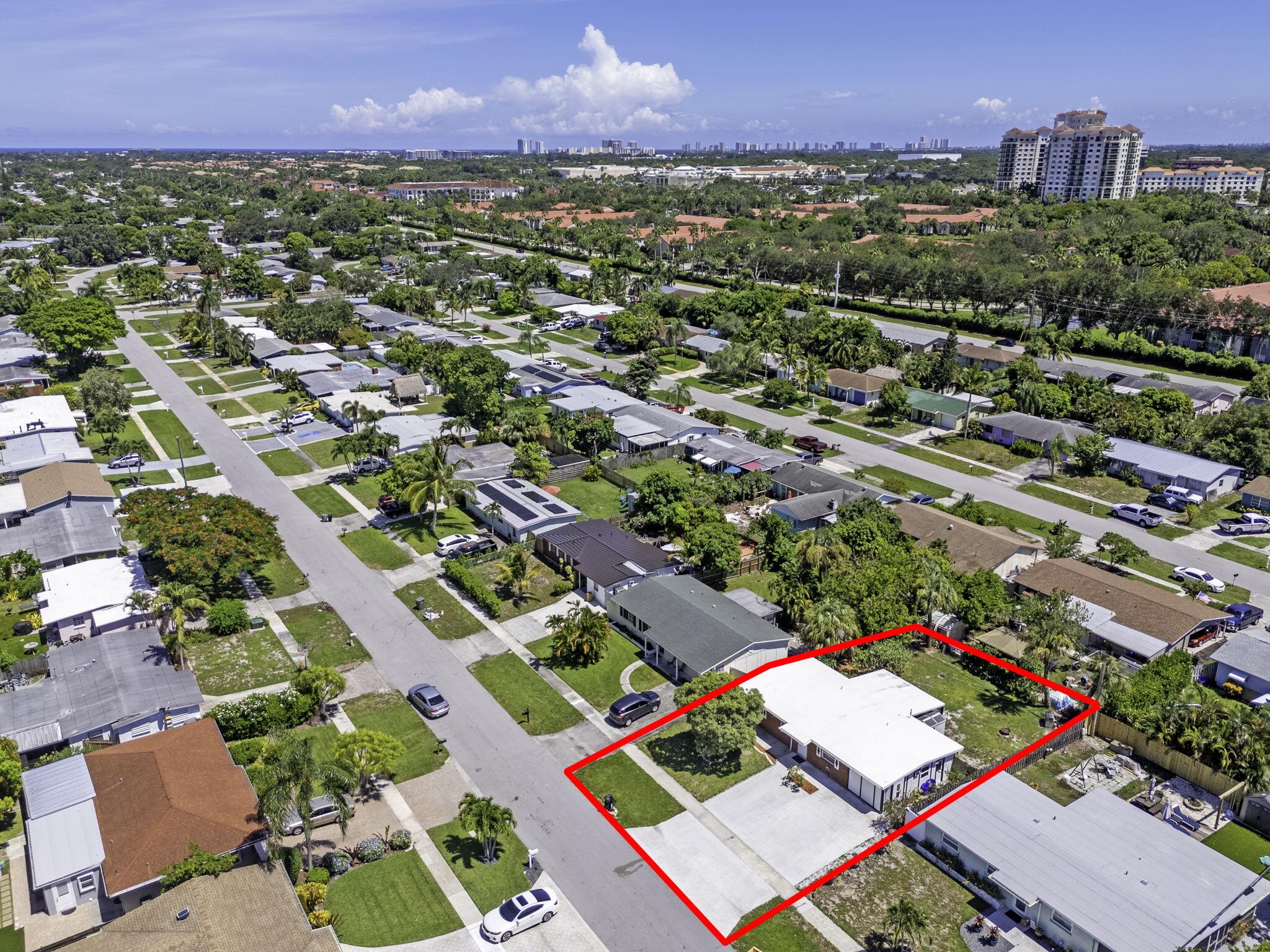 3852 Catalina Road Palm Beach Gardens, FL 33410 - Photo 45 of 48 an aerial view of residential houses with outdoor space