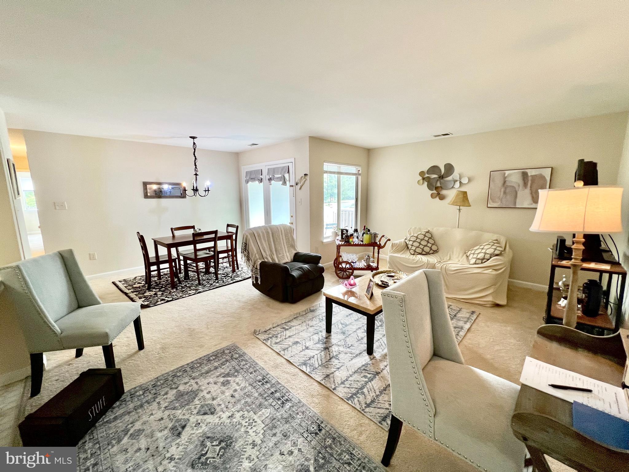 2104 Whitehall Road, Unit 1D Frederick, MD 21702 - Photo 8 of 9 a living room with furniture a rug and a table