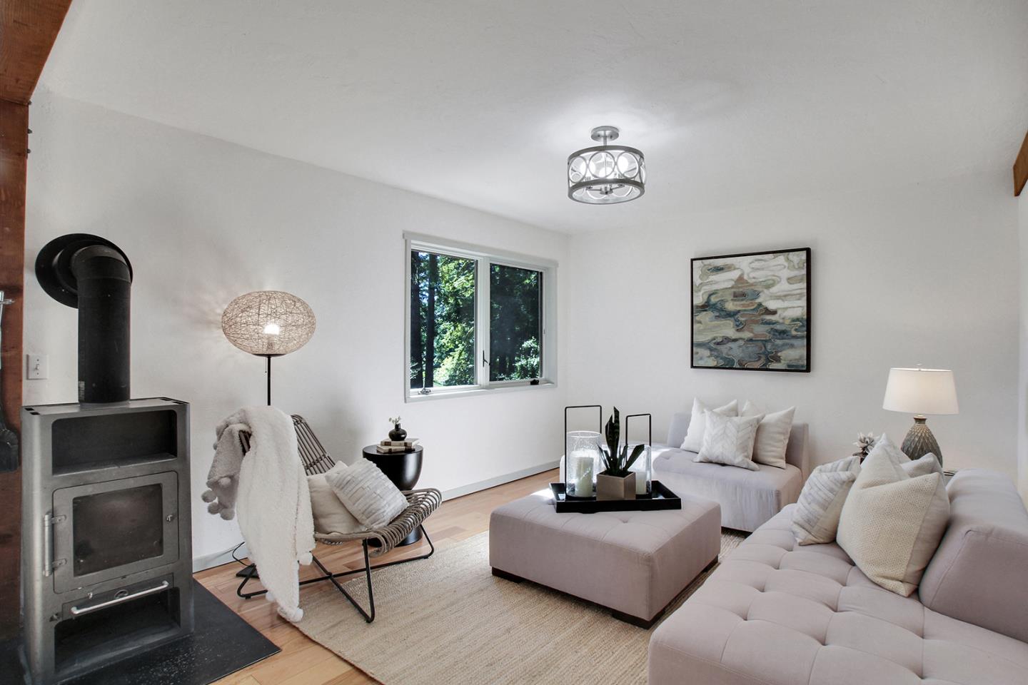 165 Old Ranch Road Woodside, CA 94062 - Photo 13 of 60 a living room with furniture and a lamp