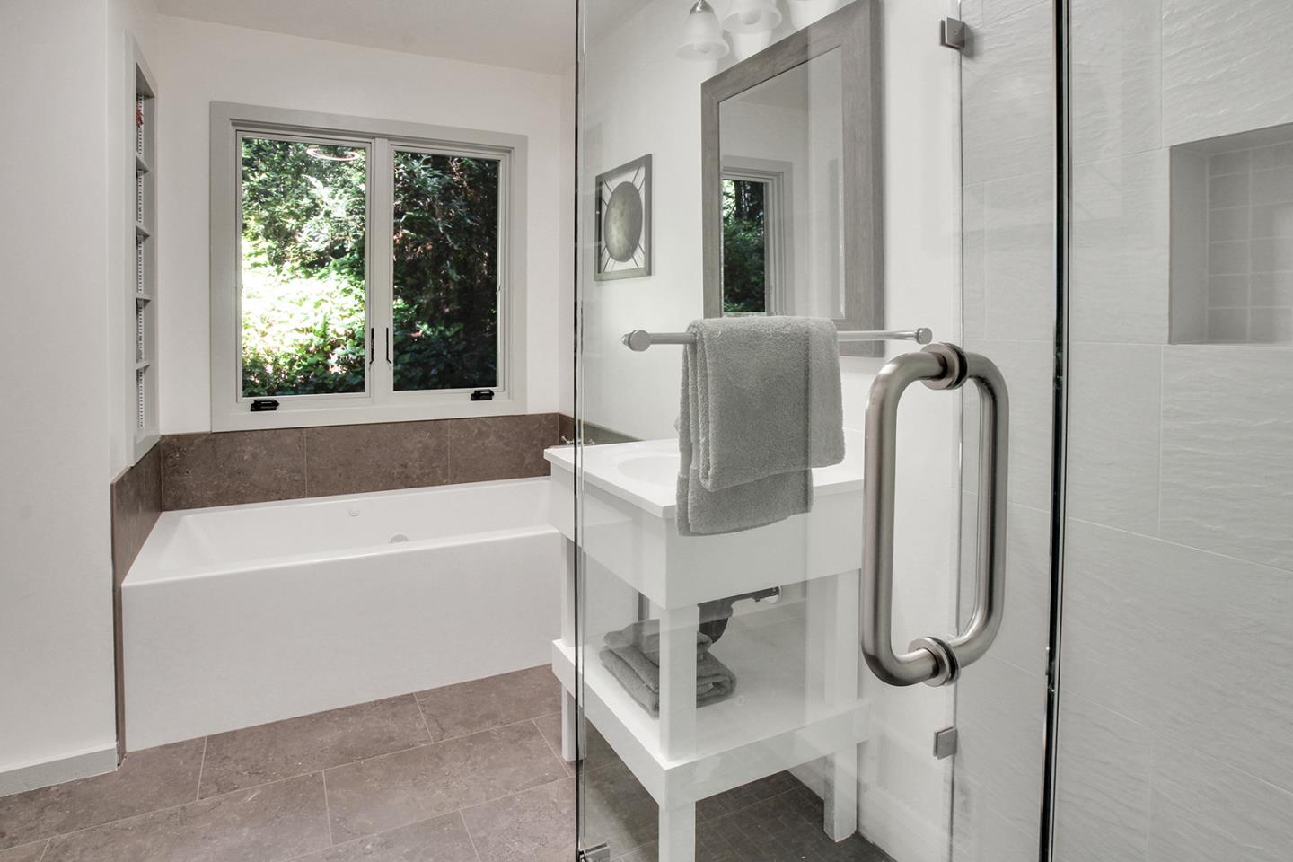 165 Old Ranch Road Woodside, CA 94062 - Photo 17 of 60 a bathroom with a tub and a shower