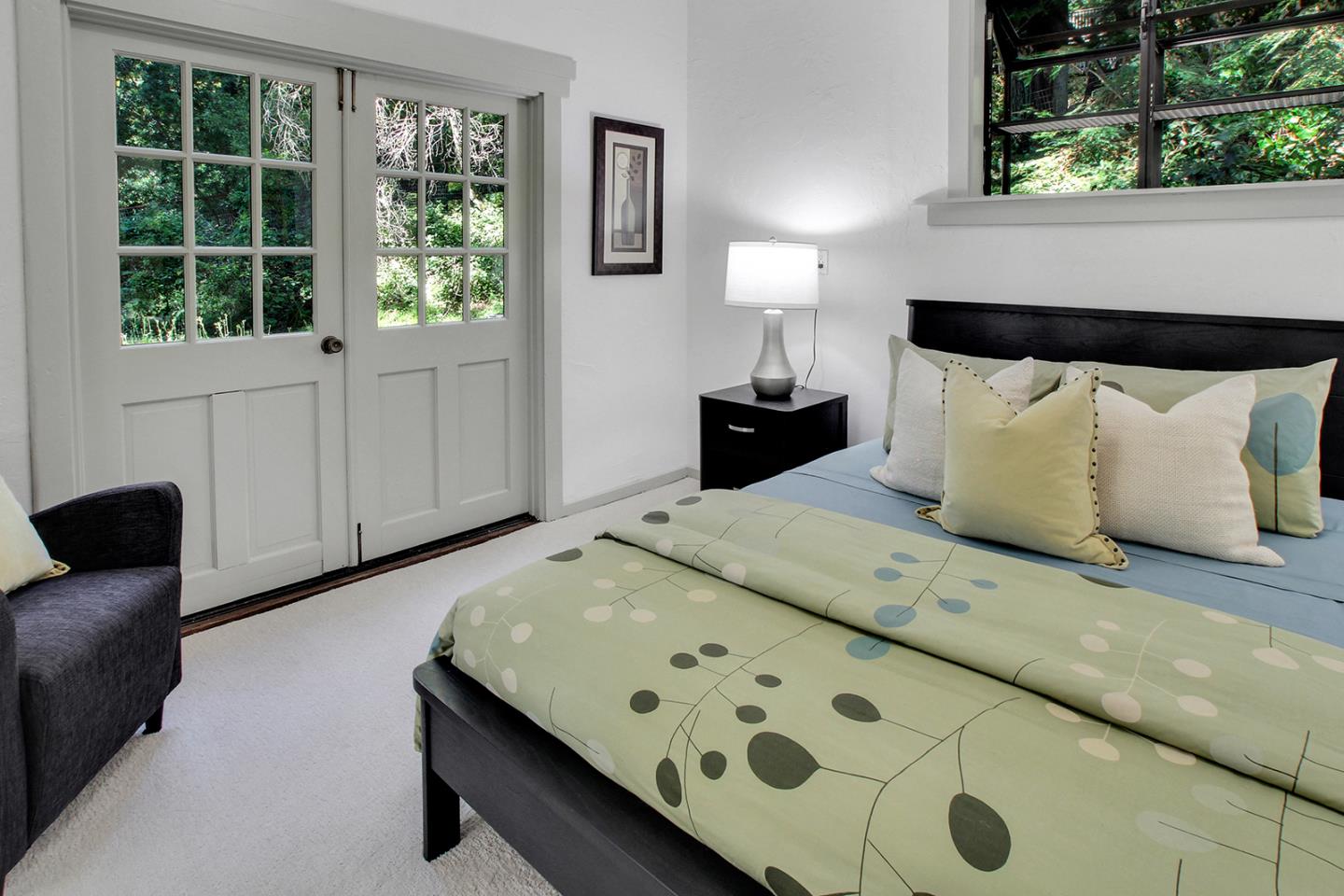 165 Old Ranch Road Woodside, CA 94062 - Photo 23 of 60 a bedroom with a bed and a window