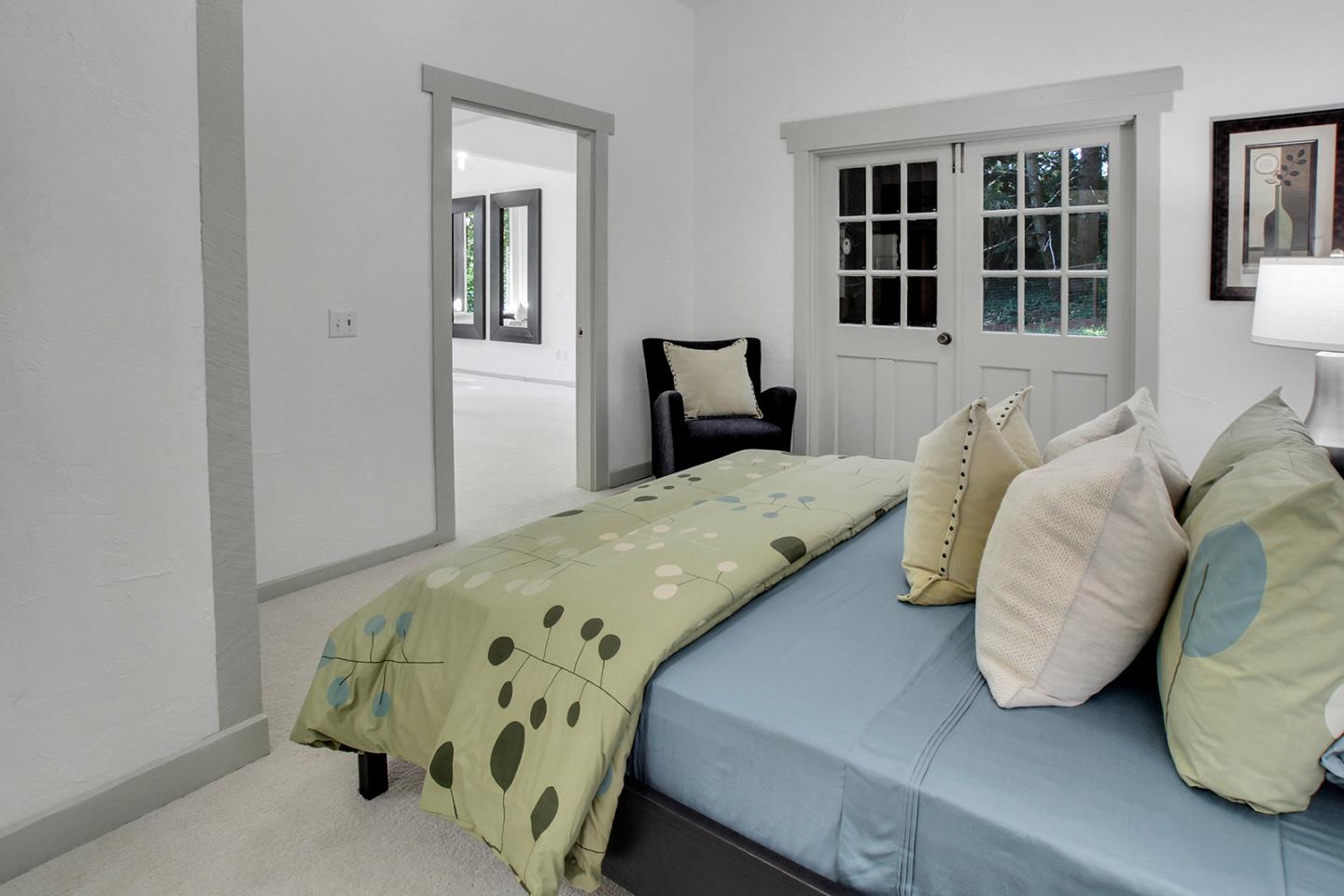 165 Old Ranch Road Woodside, CA 94062 - Photo 24 of 60 a bedroom with a bed and a window