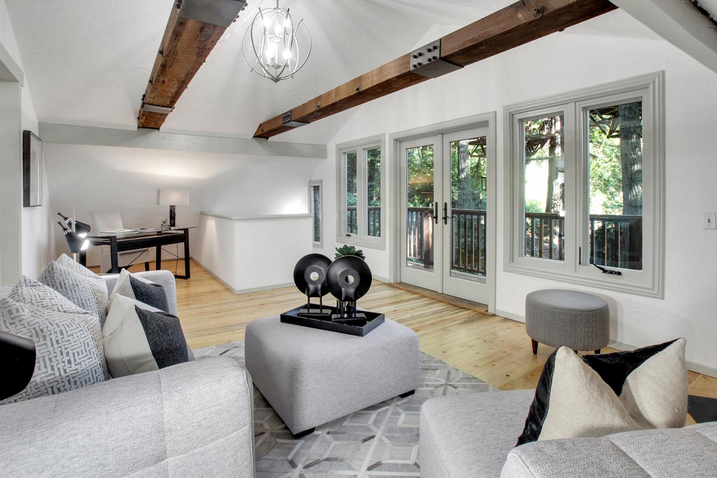 165 Old Ranch Road Woodside, CA 94062 - Photo 27 of 60 a living room with furniture a window and a chandelier