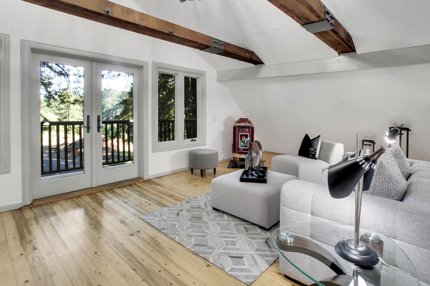 165 Old Ranch Road Woodside, CA 94062 - Photo 28 of 60 a living room with furniture and a large window