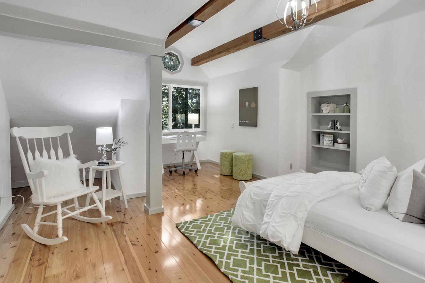 165 Old Ranch Road Woodside, CA 94062 - Photo 29 of 60 a bedroom with a bed and a table chair