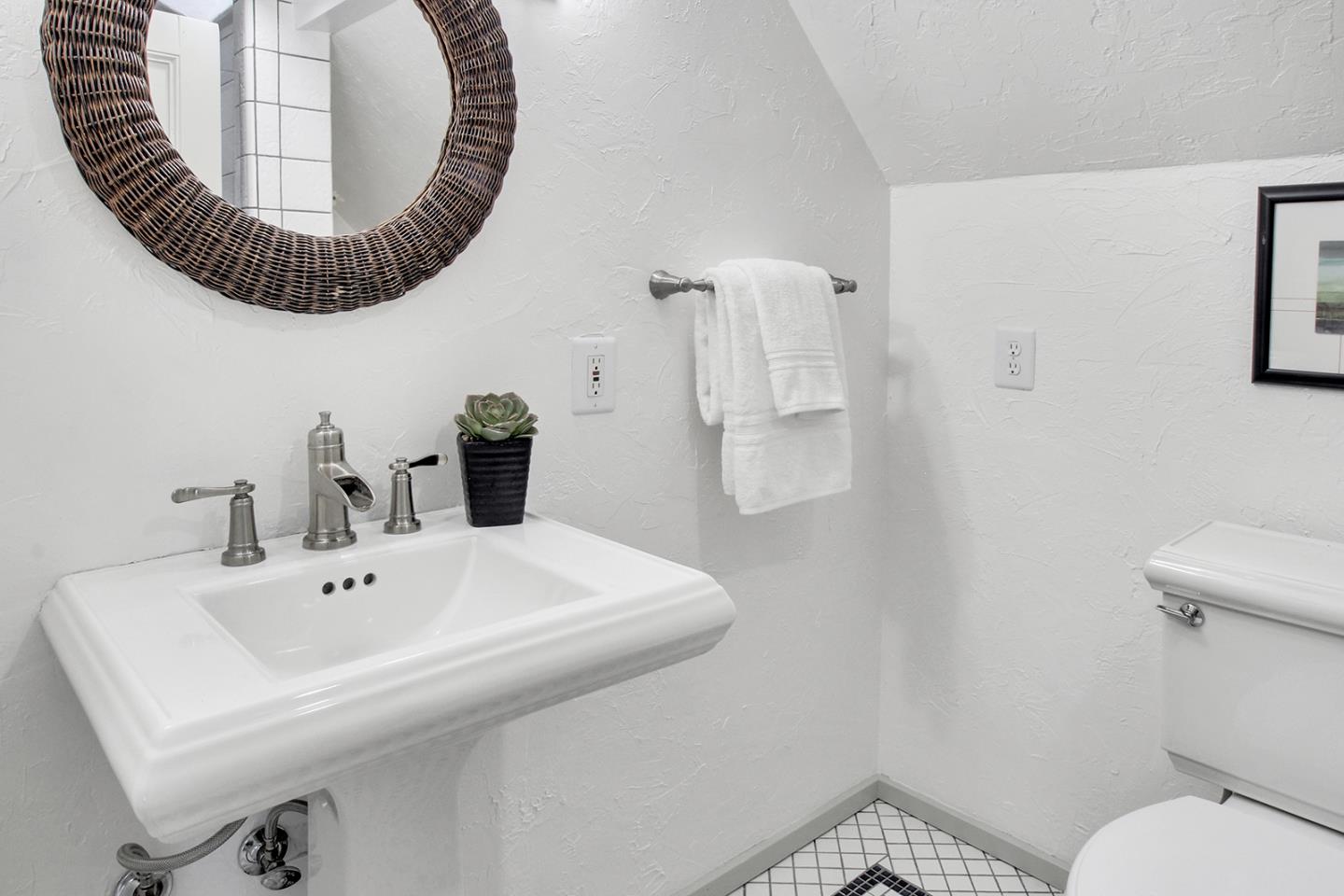 165 Old Ranch Road Woodside, CA 94062 - Photo 32 of 60 a bathroom with a sink and mirror