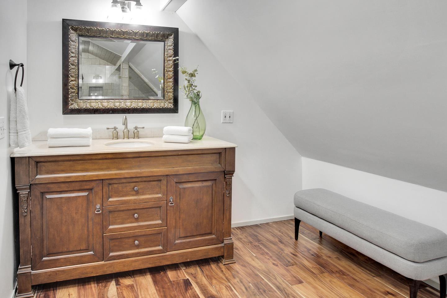 165 Old Ranch Road Woodside, CA 94062 - Photo 38 of 60 a bathroom with a sink a mirror and a vanity