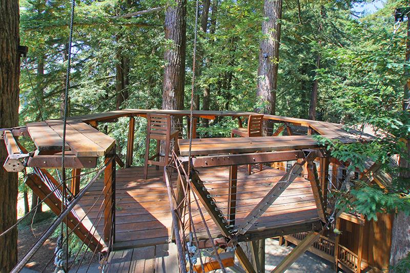 165 Old Ranch Road Woodside, CA 94062 - Photo 46 of 60 a view of balcony with wooden floor and outdoor seating