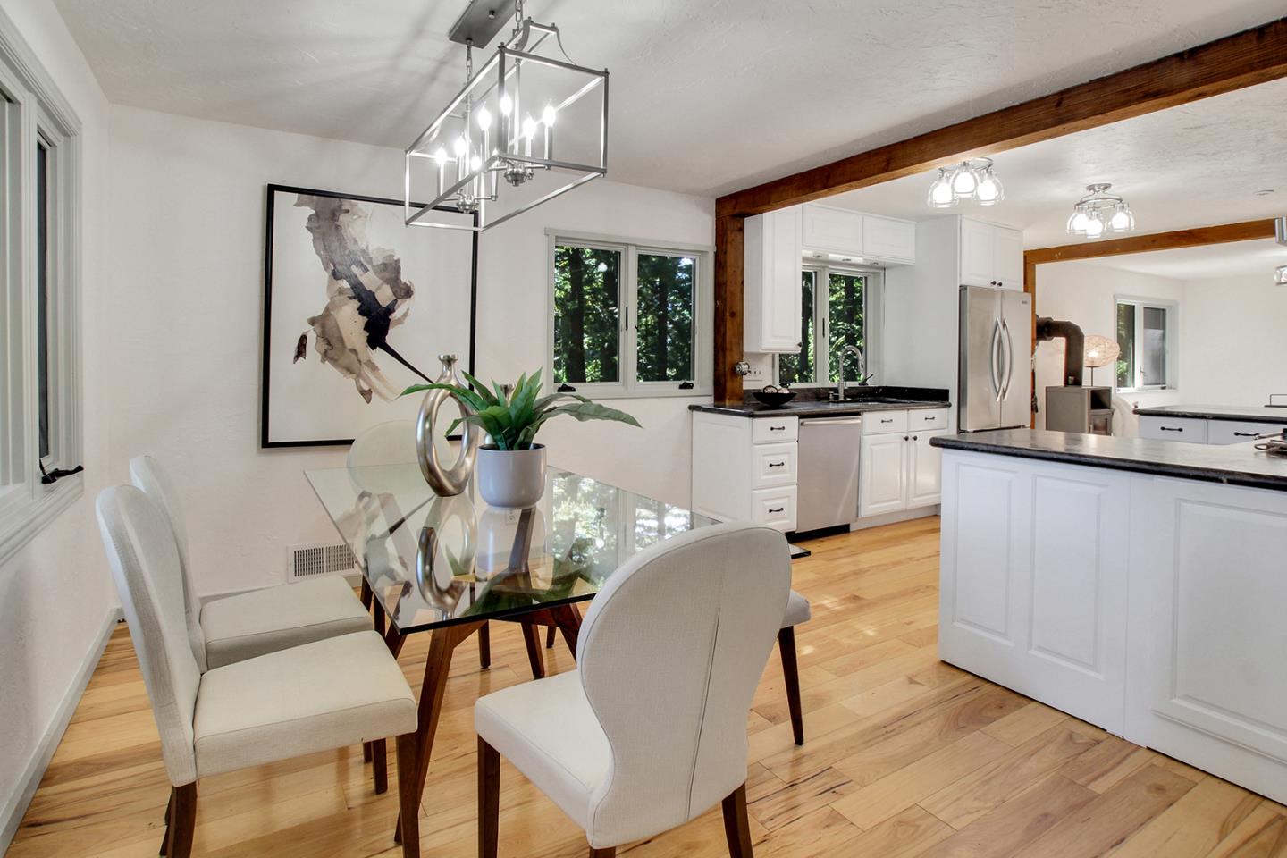165 Old Ranch Road Woodside, CA 94062 - Photo 6 of 60 a view of a dining room with furniture and chandelier