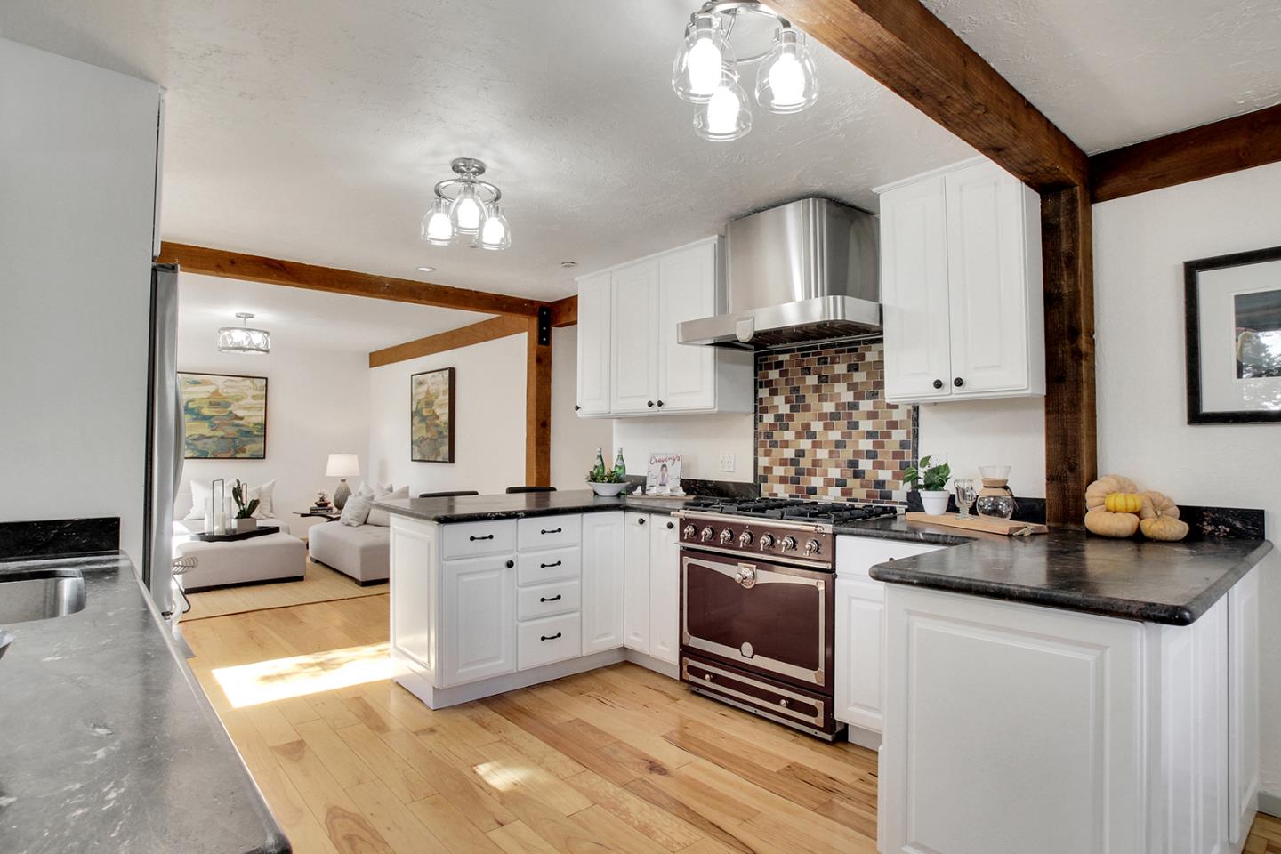 165 Old Ranch Road Woodside, CA 94062 - Photo 8 of 60 a kitchen with stainless steel appliances a stove sink and cabinets
