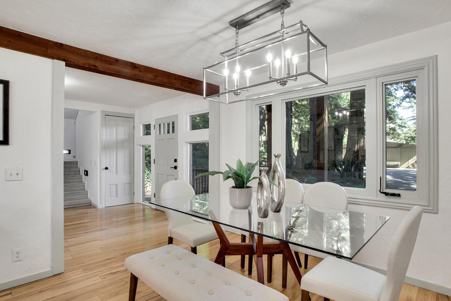 165 Old Ranch Road Woodside, CA 94062 - Photo 10 of 60 a view of a dining room with furniture large windows and wooden floor