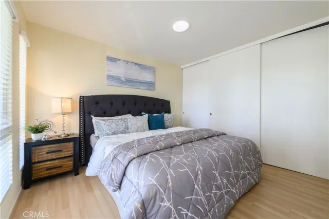 a bedroom with a bed and a dresser