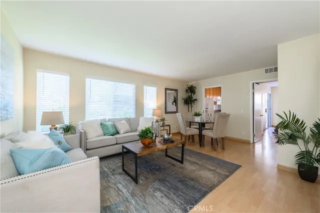 a living room with furniture and windows