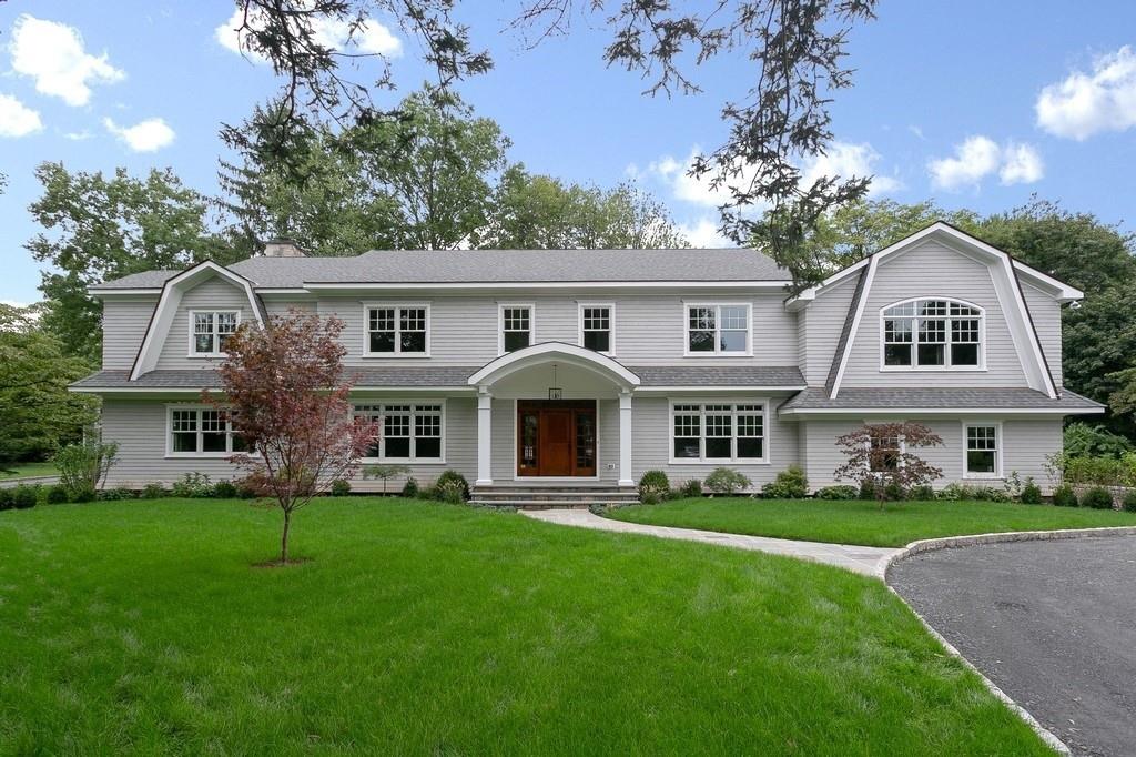20 Hunt Place Rye, NY 10580 - Photo 1 of 1 a front view of house with yard and green space