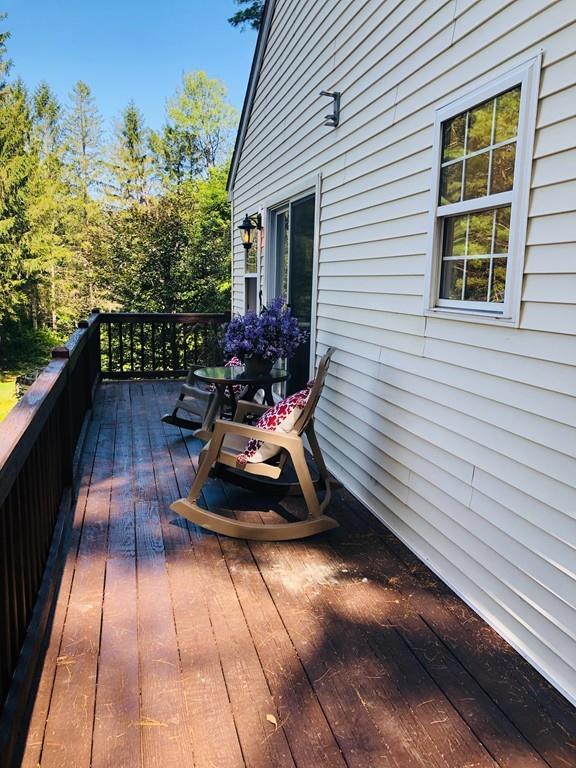 499 Jacksonville Road Colrain, MA 01340 - Photo 5 of 30 a view of a chairs and tables in the balcony