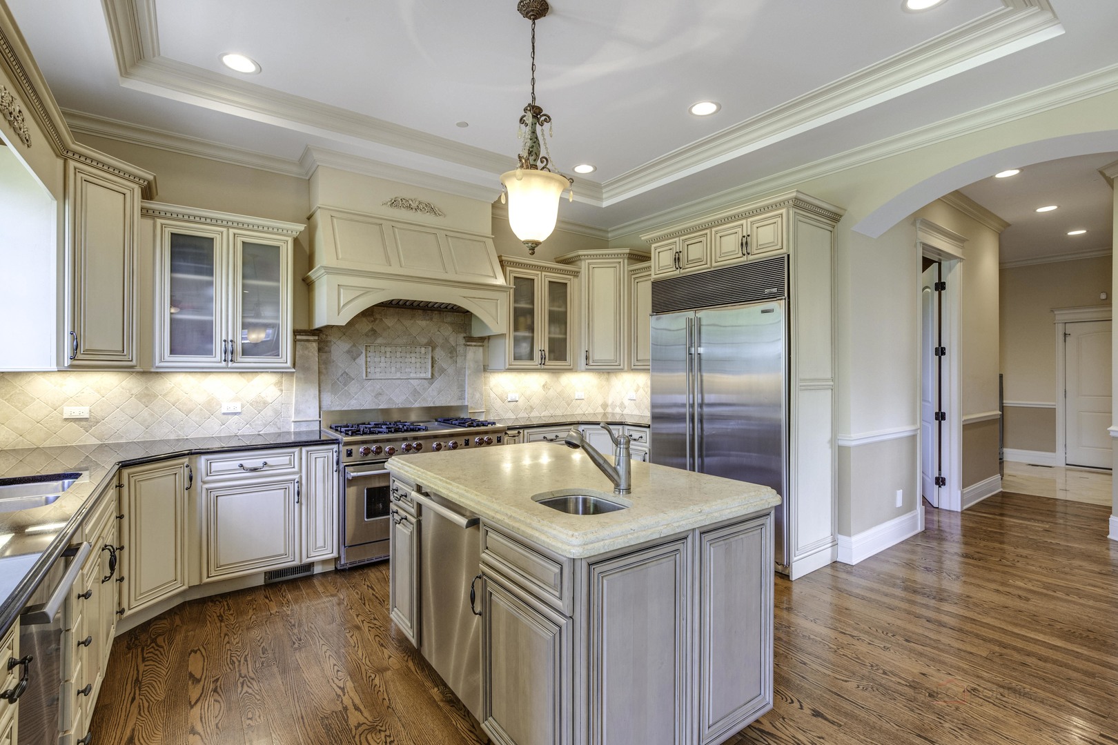 214 Linden Road Northbrook, IL 60062 - Photo 18 of 56 a kitchen with stove cabinets and wooden floor