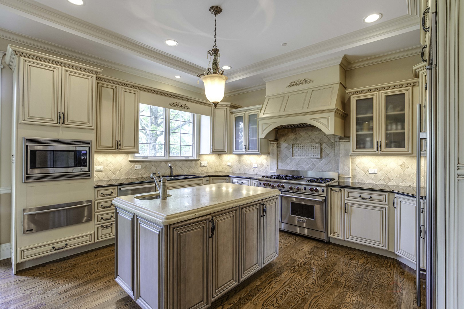 214 Linden Road Northbrook, IL 60062 - Photo 19 of 56 a kitchen with stainless steel appliances granite countertop a stove and a sink