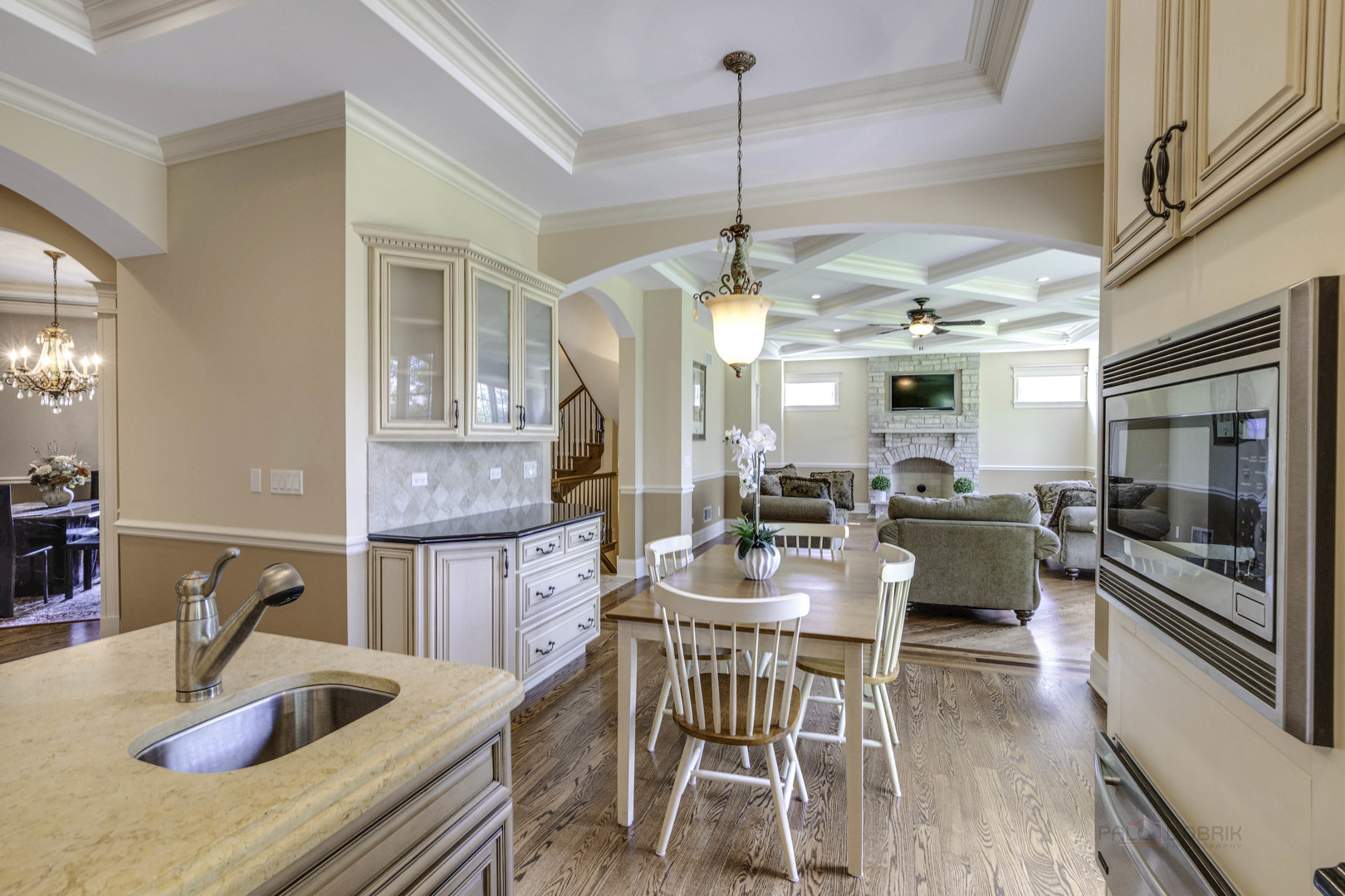 214 Linden Road Northbrook, IL 60062 - Photo 21 of 56 a kitchen with a table chairs stove and wooden floor