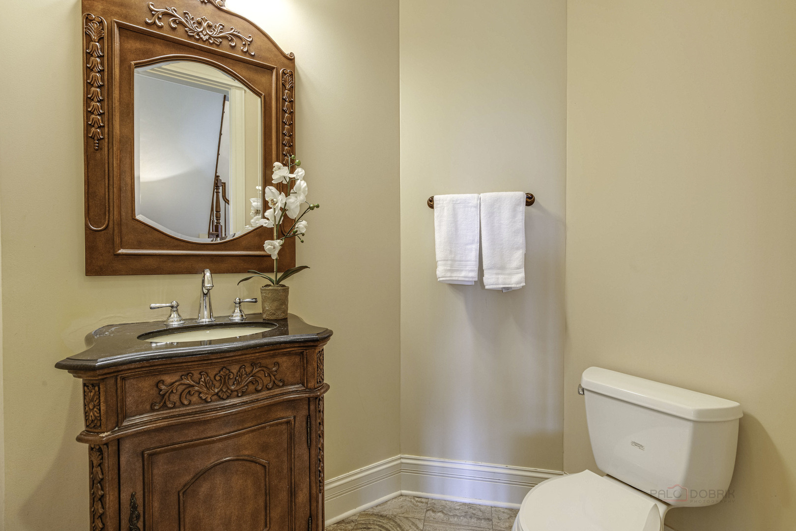 214 Linden Road Northbrook, IL 60062 - Photo 24 of 56 a bathroom with a toilet a sink and mirror