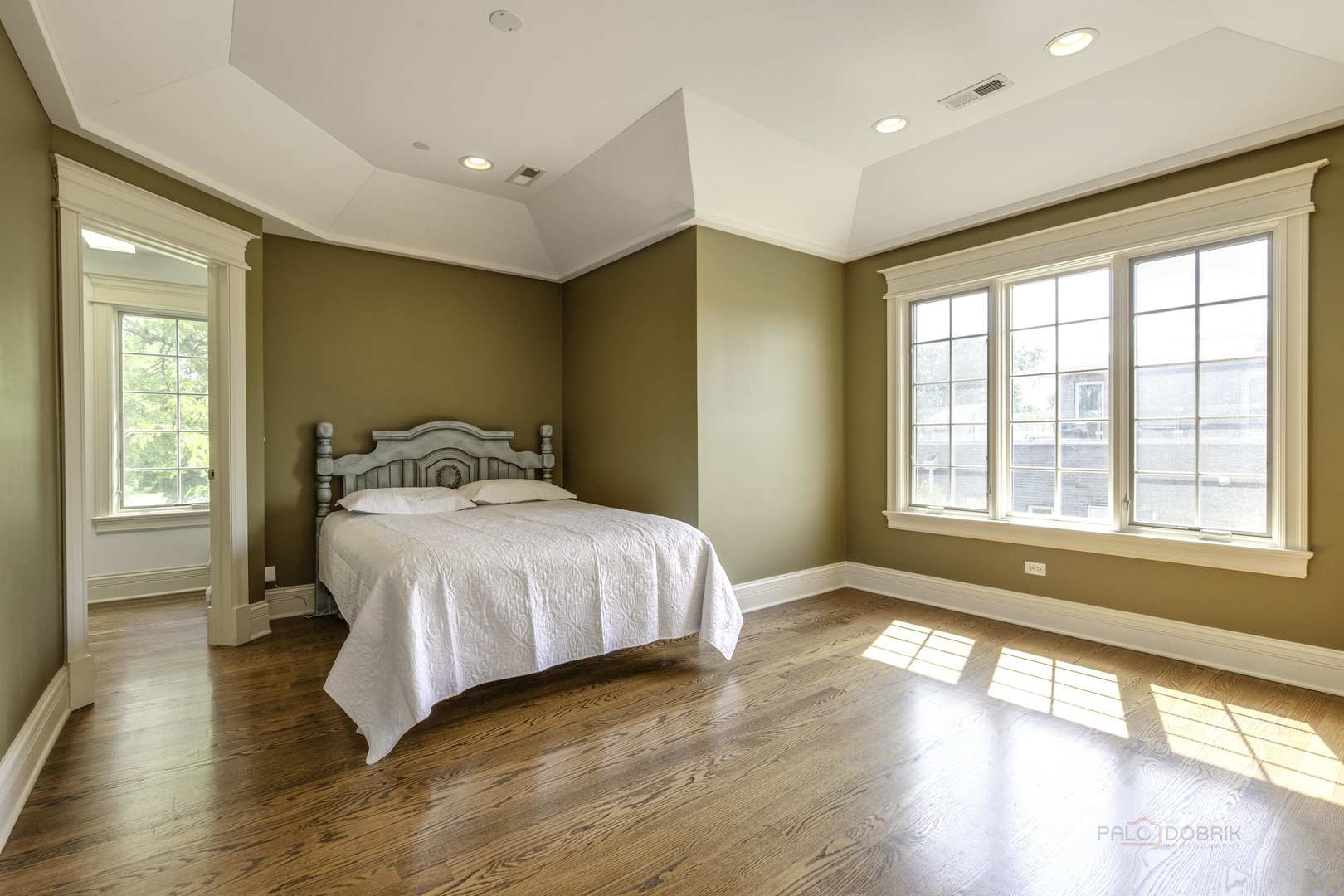 214 Linden Road Northbrook, IL 60062 - Photo 38 of 56 a bedroom with a large bed and wooden floor