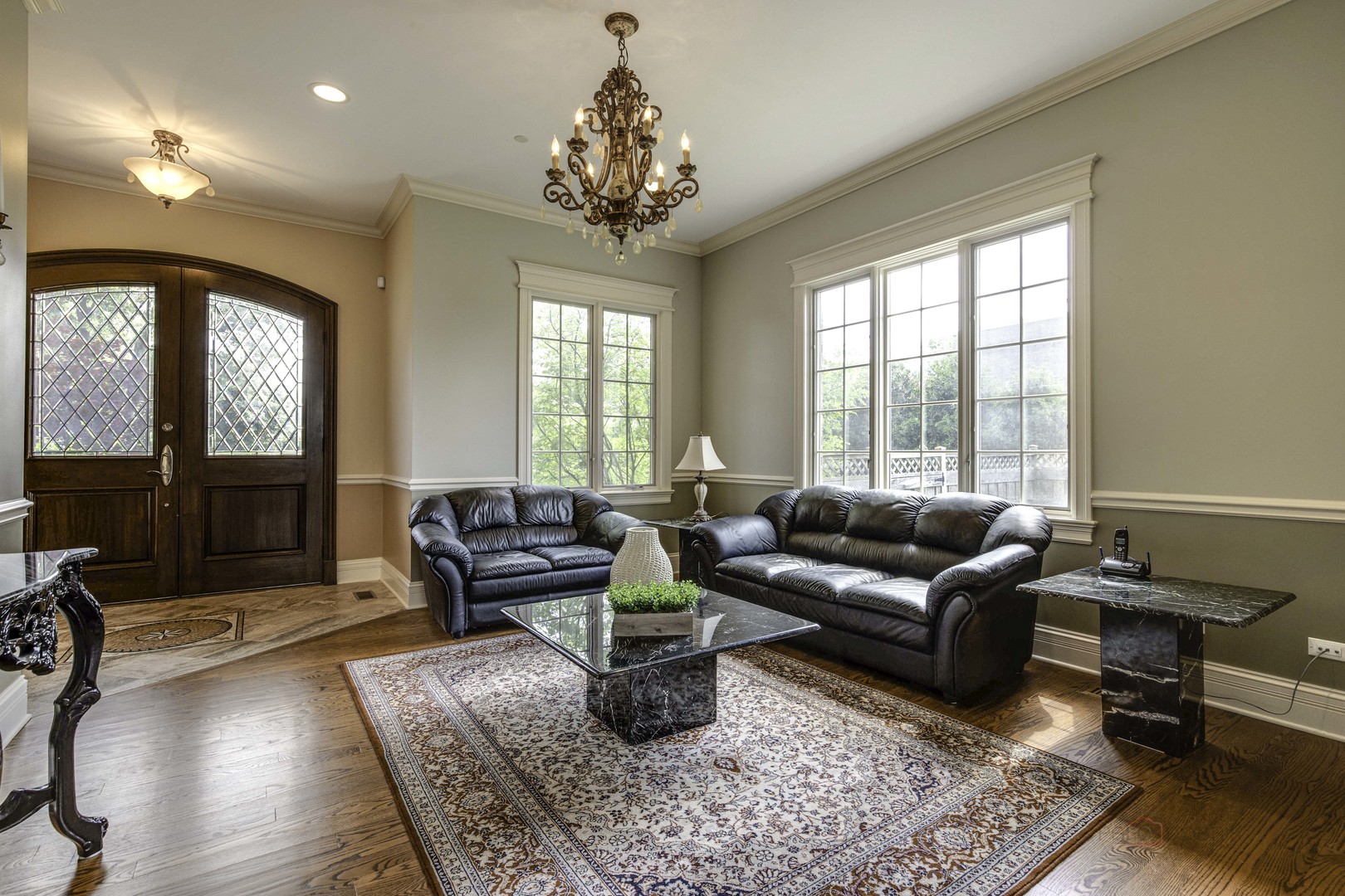 214 Linden Road Northbrook, IL 60062 - Photo 9 of 56 a living room with furniture and a chandelier