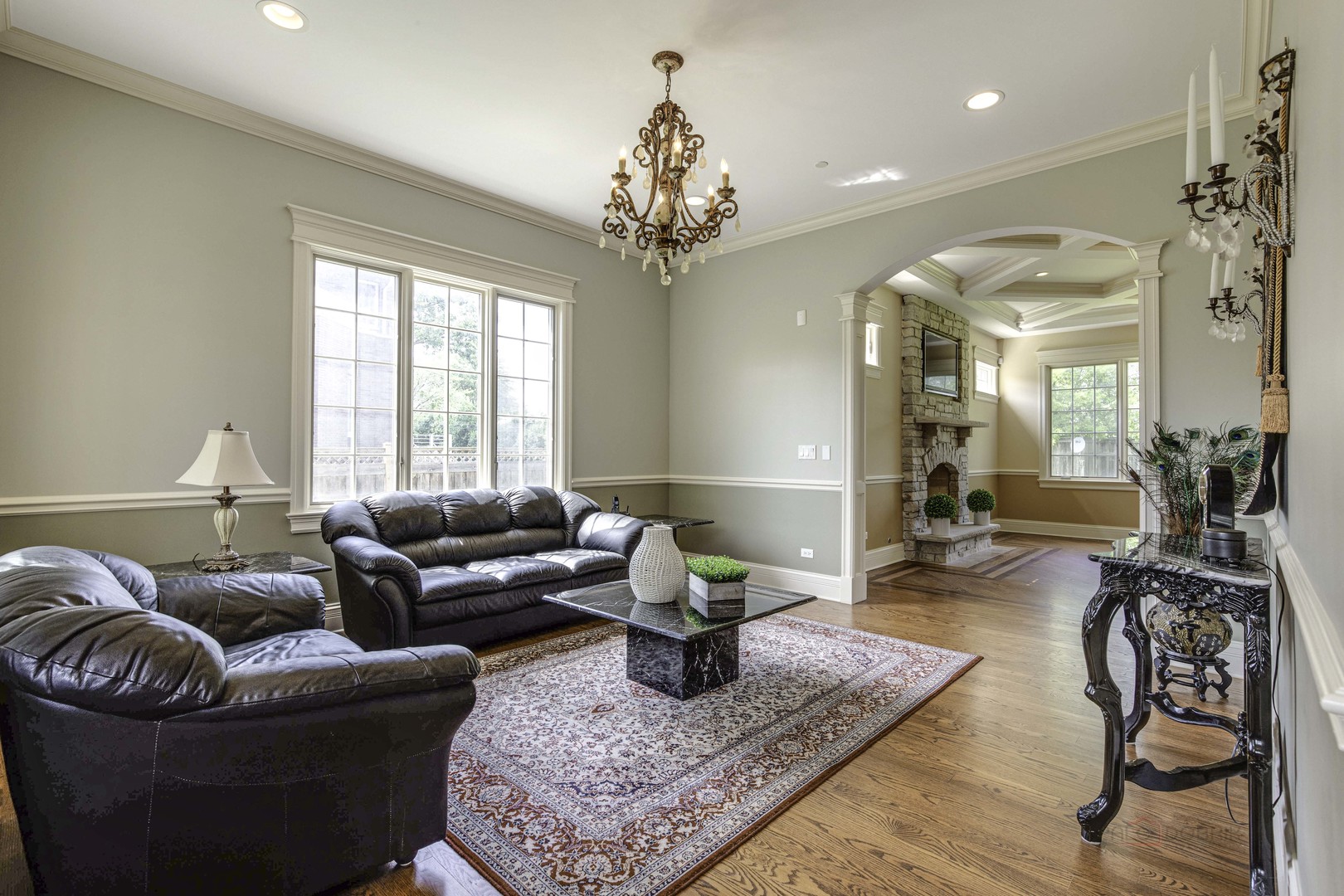 214 Linden Road Northbrook, IL 60062 - Photo 10 of 56 a living room with furniture and a chandelier