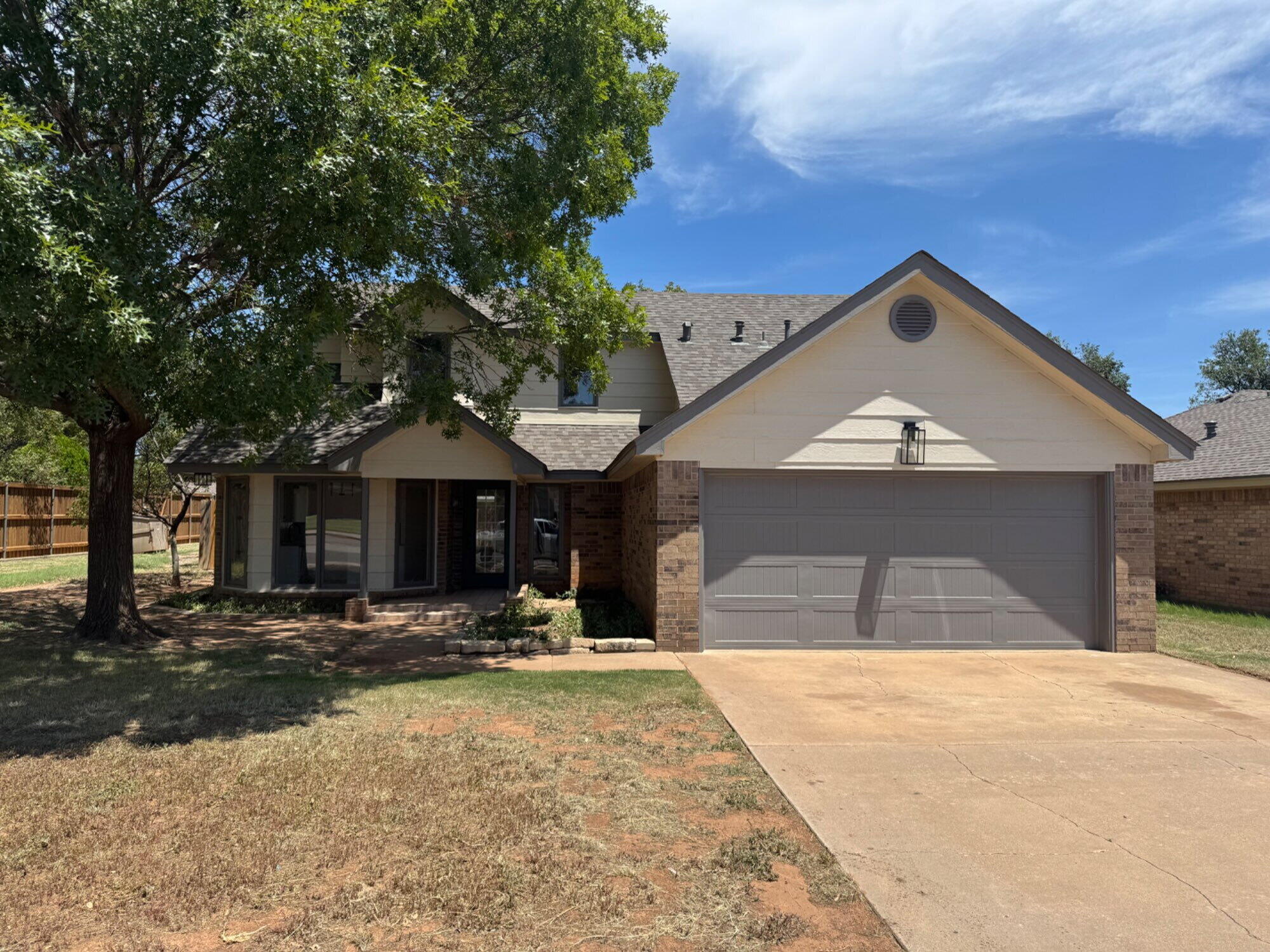 5510 87th Street Lubbock, TX 79424 - Photo 1 of 13 a front view of a house with a yard