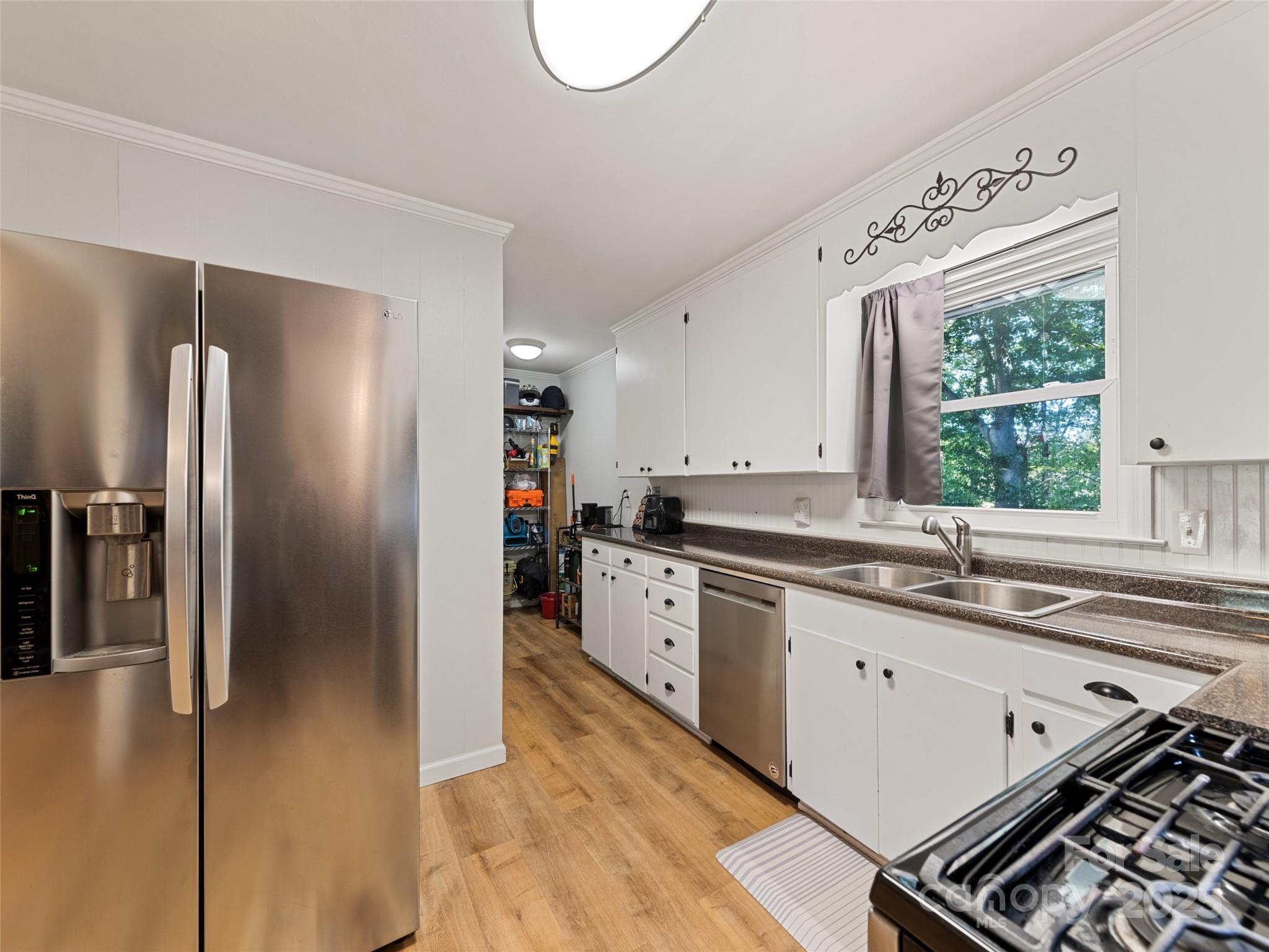 263 Blanton Street Columbus, NC 28722 - Photo 15 of 45 a kitchen with stainless steel appliances granite countertop a refrigerator and a sink