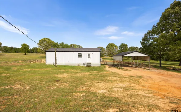 a view of a house with a big yard