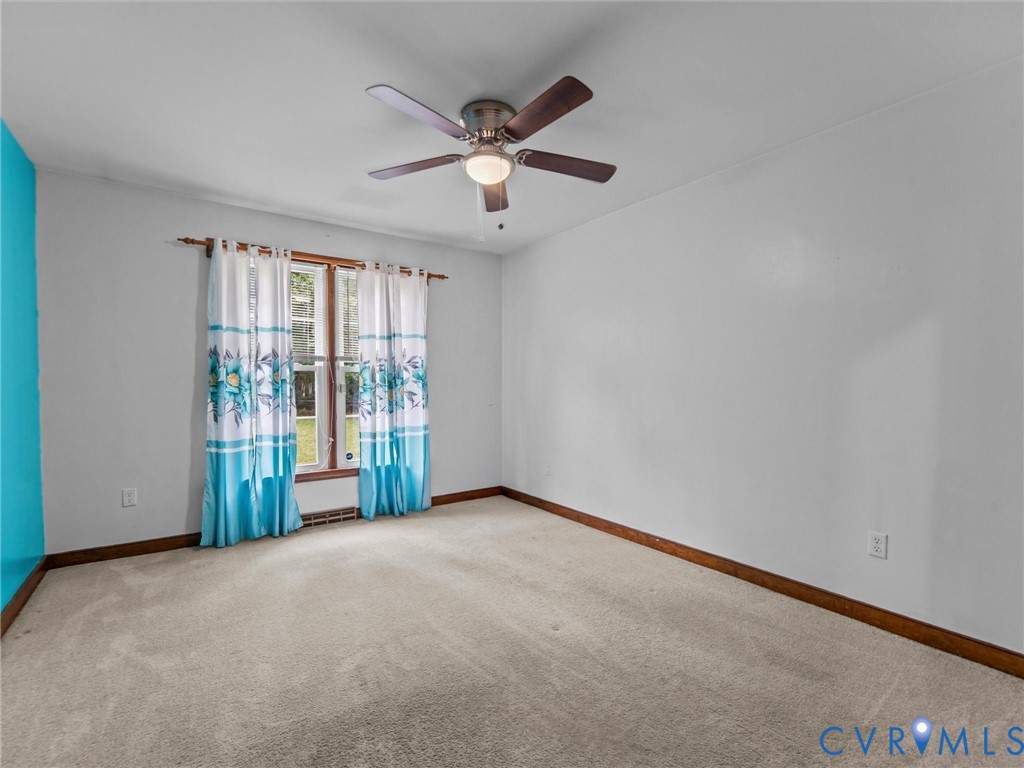 3420 State Rte 656 Powhatan, VA 23139 - Photo 19 of 37 an empty room with ceiling fan and windows