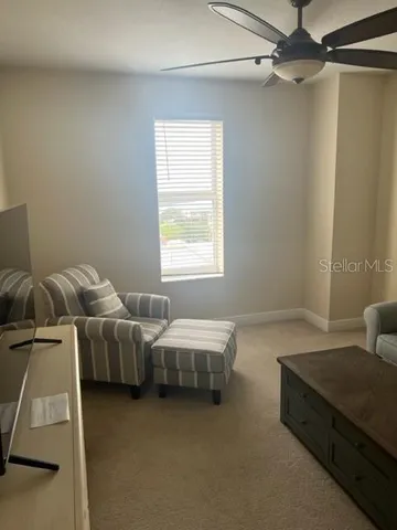 a spacious bedroom with two beds and a window