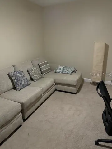 a living room with furniture and a couch