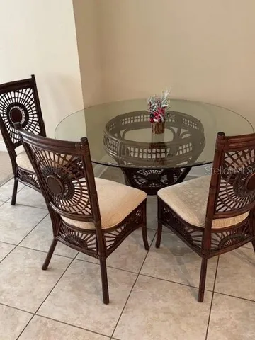 a view of a chairs and tables in the back