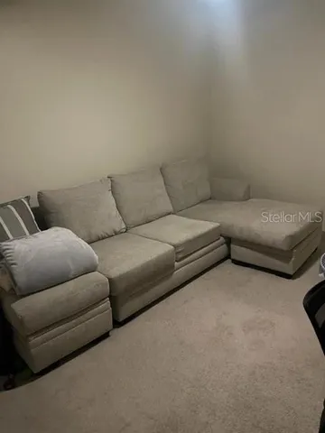 a living room with couches and a couch