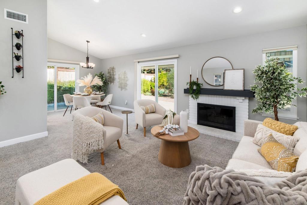 2725 Glasgow Drive Carlsbad, CA 92010 - Photo 1 of 41 a living room with furniture and a fireplace
