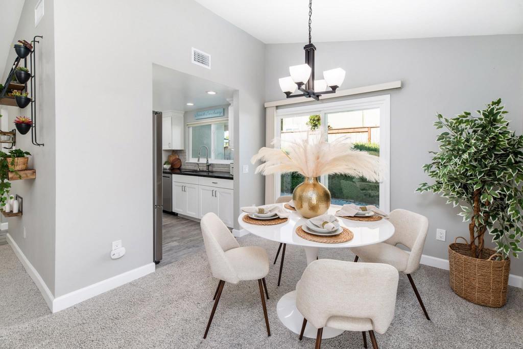 2725 Glasgow Drive Carlsbad, CA 92010 - Photo 11 of 41 a dining room with furniture a chandelier and window