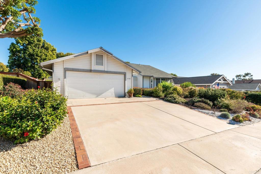 2725 Glasgow Drive Carlsbad, CA 92010 - Photo 35 of 41 a front view of a house with a yard and garage