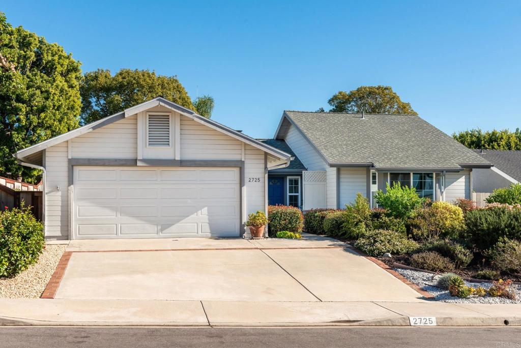2725 Glasgow Drive Carlsbad, CA 92010 - Photo 39 of 41 a front view of a house with a yard and garage