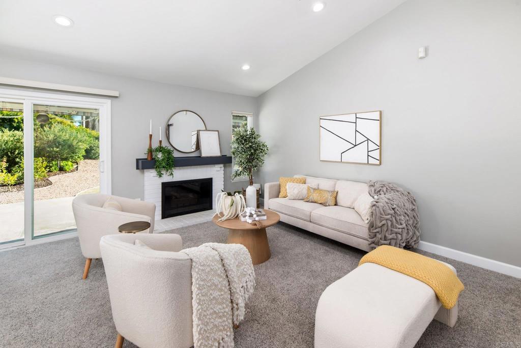 2725 Glasgow Drive Carlsbad, CA 92010 - Photo 4 of 41 a living room with furniture a window and a fireplace