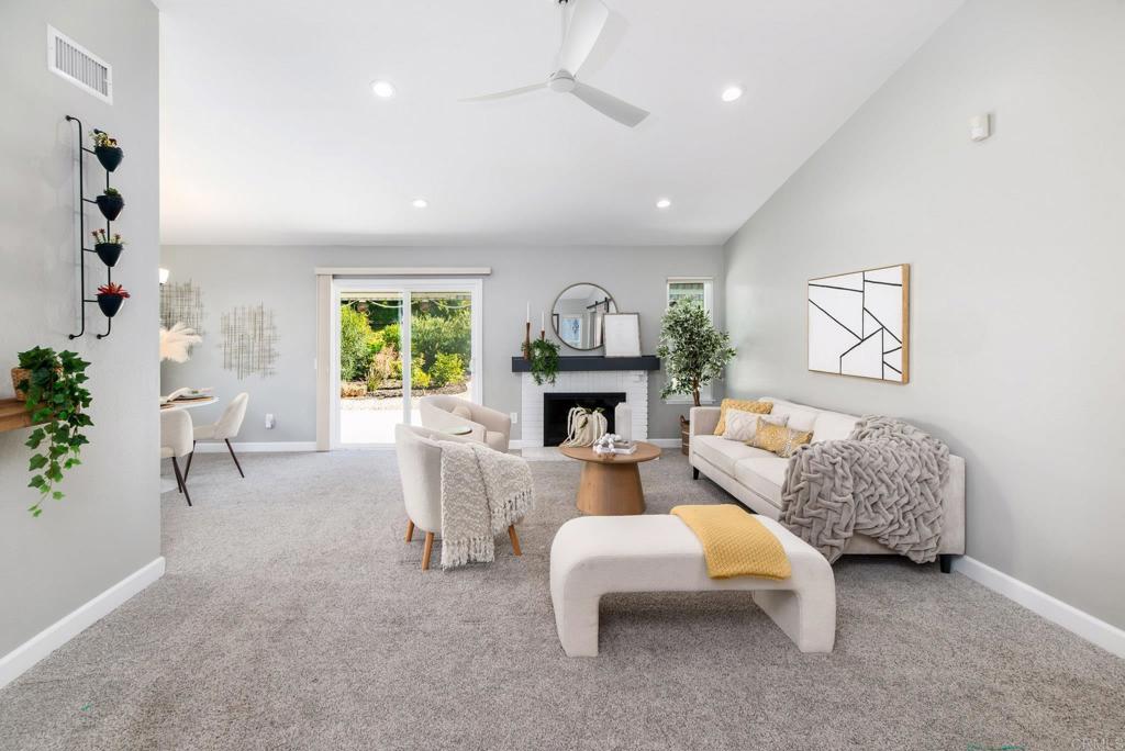2725 Glasgow Drive Carlsbad, CA 92010 - Photo 6 of 41 a living room with furniture and a fireplace