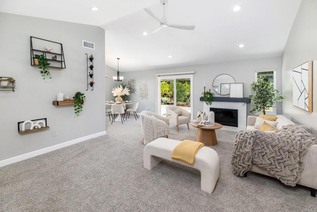 2725 Glasgow Drive Carlsbad, CA 92010 - Photo 7 of 41 a living room with furniture and a fireplace
