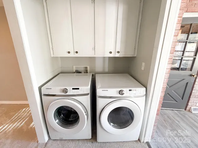 a utility room with dryer and washer