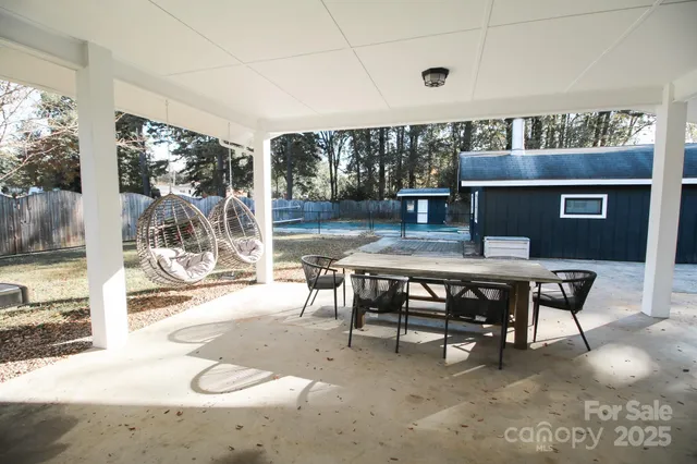a view of a dining room with furniture wooden floor and a rug