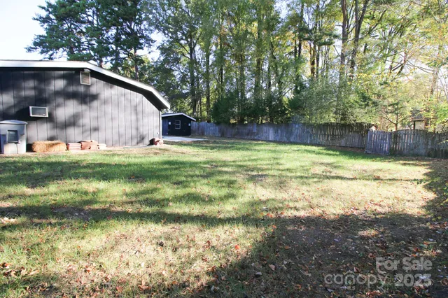 a swimming pool with trees in the background