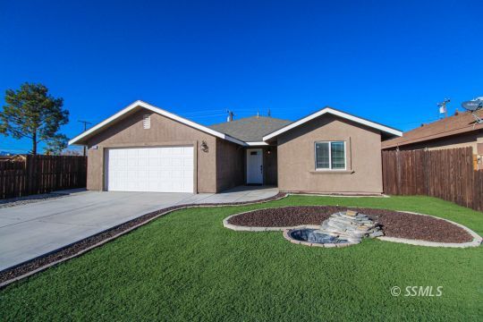 1000 West Iowa Avenue Ridgecrest, CA 93555 - Photo 1 of 32 a view of a house with a yard